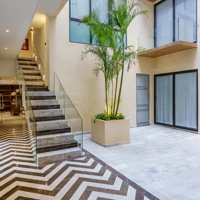 Image of a Interior Courtyard, featuring Marble Flooring and Chevron Pattern Floors.