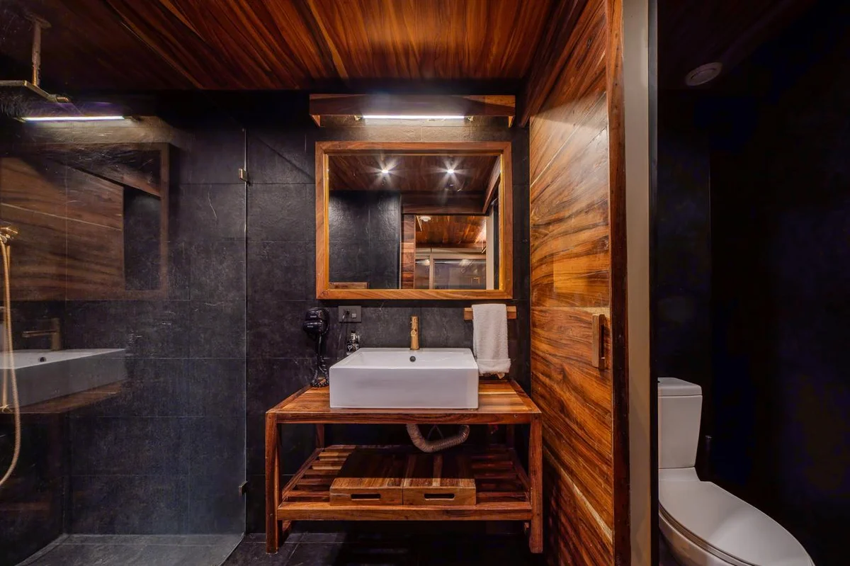 Image of a Modern Bathroom, featuring Wood Paneling and Slate Tile Walls.