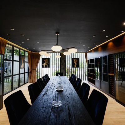 Image of a Formal Dining Room, featuring Built-in Wine Storage and Modern Designer Lighting.