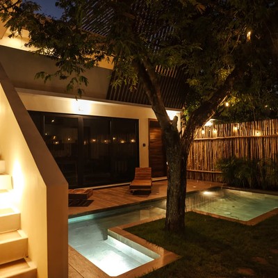 Image of a Private Plunge Pool, featuring Lush Garden and Ambient Outdoor Lighting.