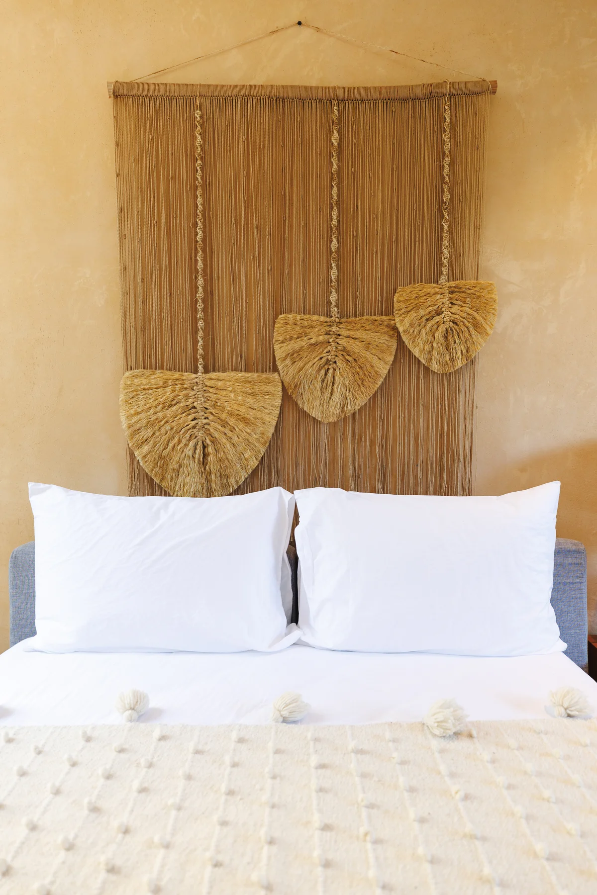 Image of a Bedroom, featuring Bohemian Decor and Woven Wall Hanging.