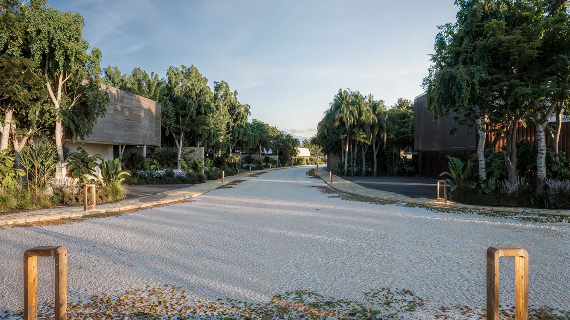Image of a Private Residential Street, featuring Lush Landscaping and Modern Architecture.