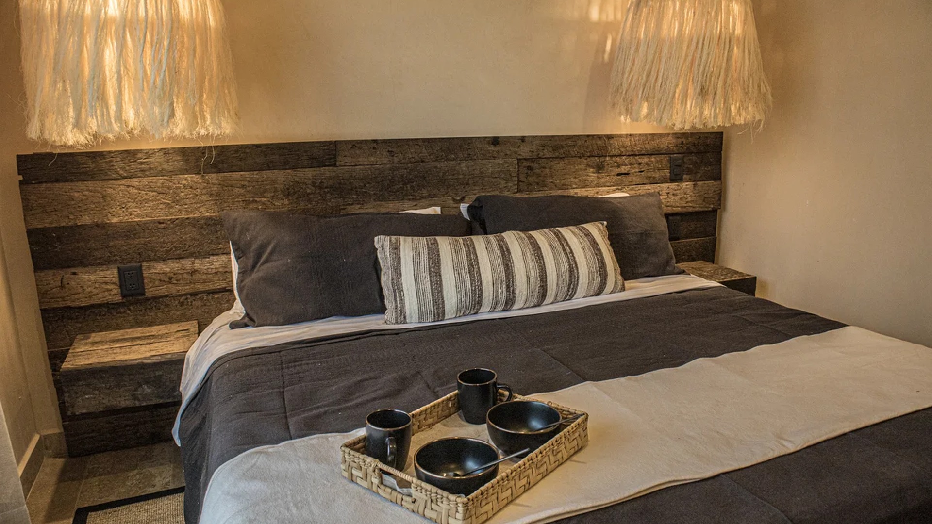 Image of a Rustic Bedroom, featuring Reclaimed Wood Headboard and Built-in Nightstands.