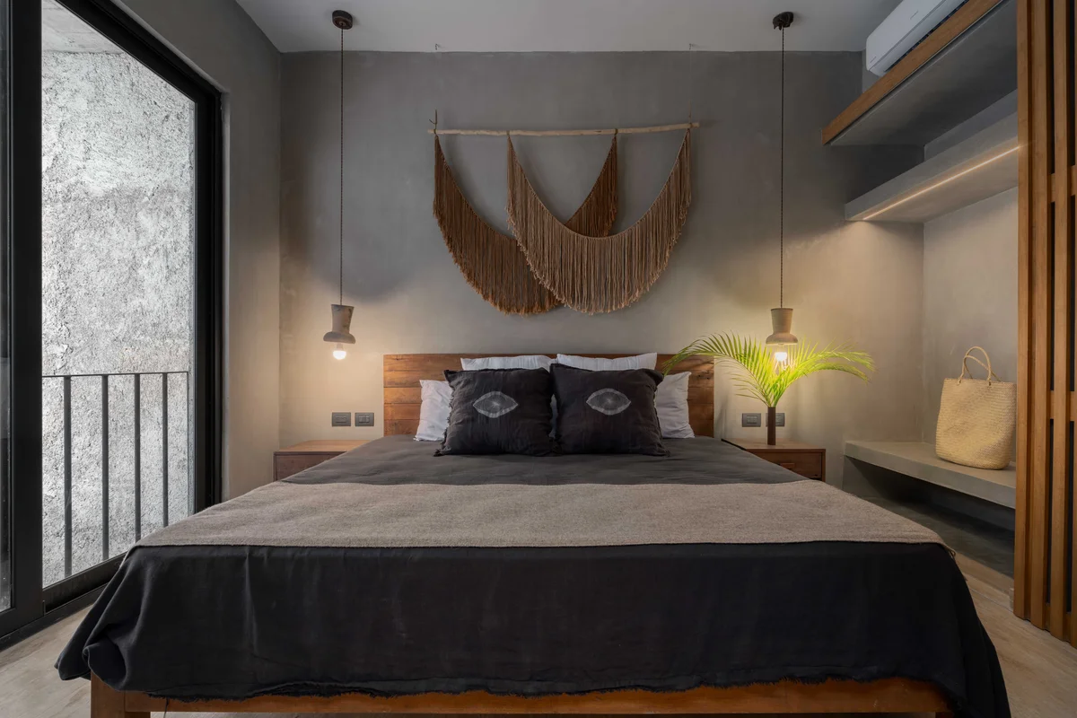 Image of a Modern Bedroom, featuring Polished Concrete Walls and Juliet Balcony.