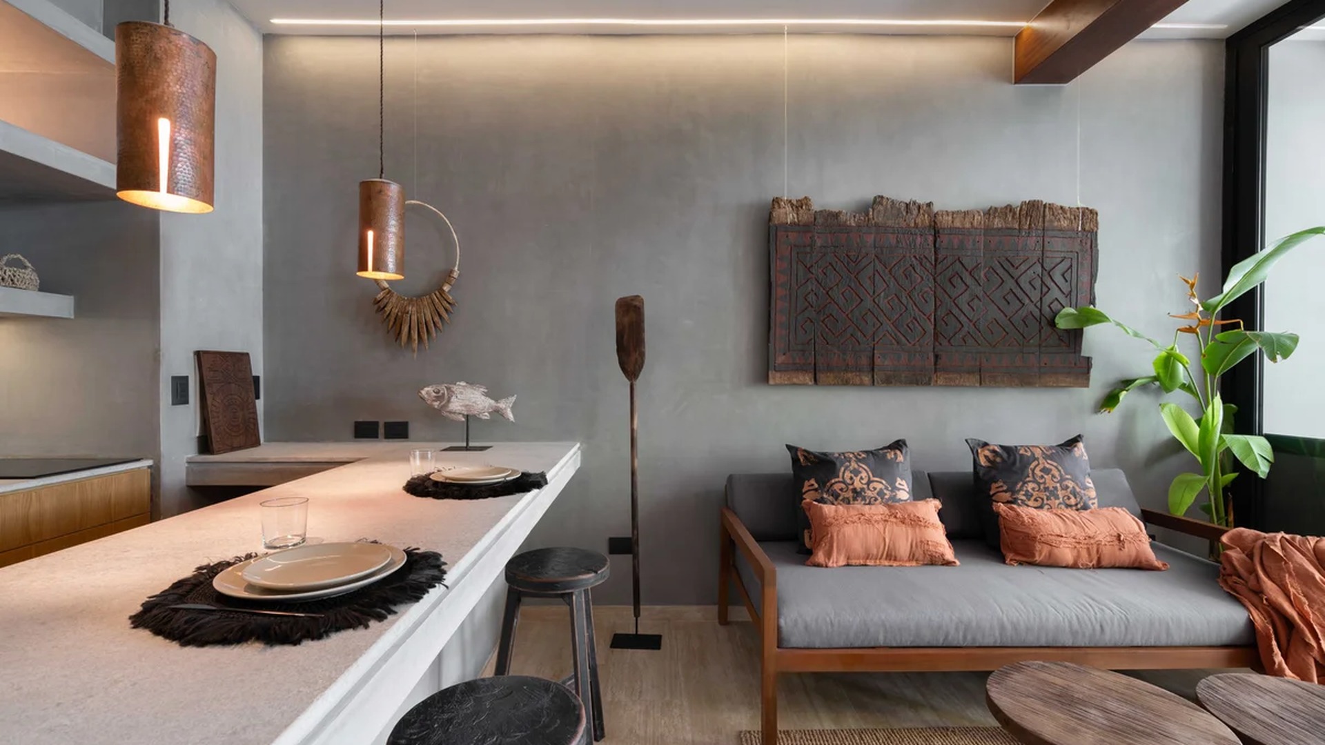 Image of a Open-Concept Living, featuring Breakfast Bar and Concrete Accent Walls.