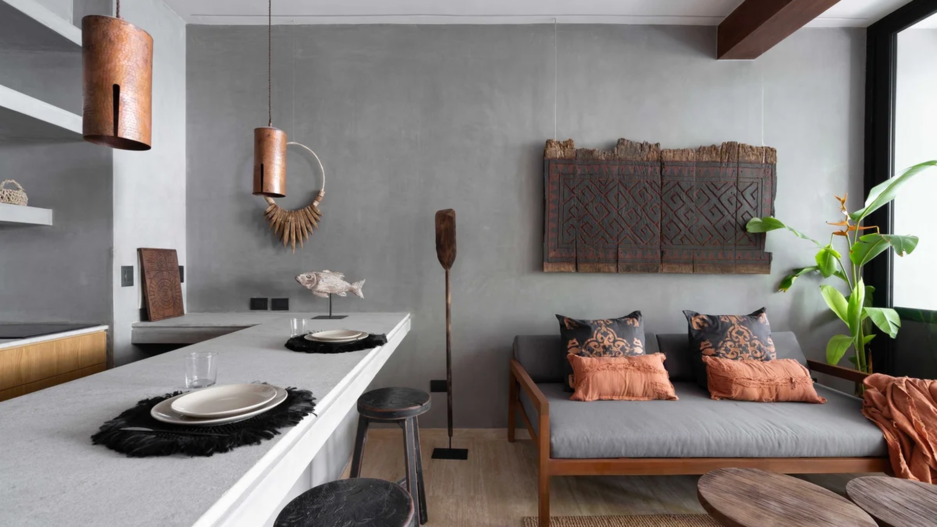 Image of a Open-Plan Kitchen, featuring Breakfast Bar and Concrete Walls.