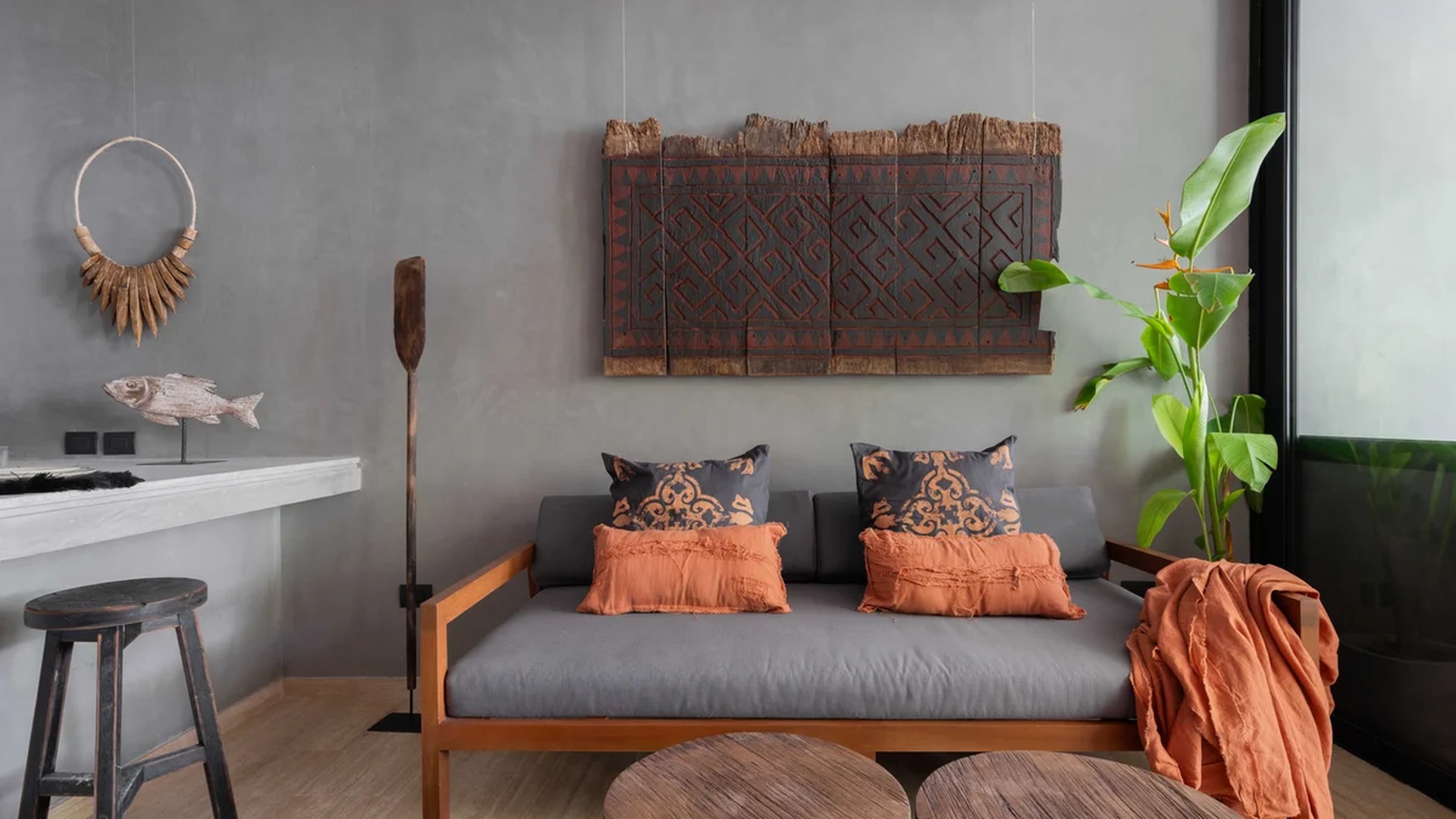 Image of a Lounge Area, featuring Bohemian Style and Concrete Walls.