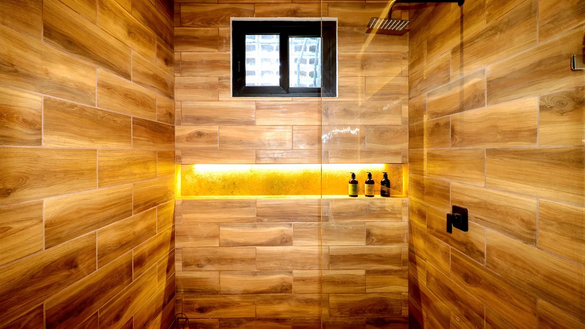 Image of a Walk-In Shower, featuring Wood-Look Tile and Rainfall Showerhead.
