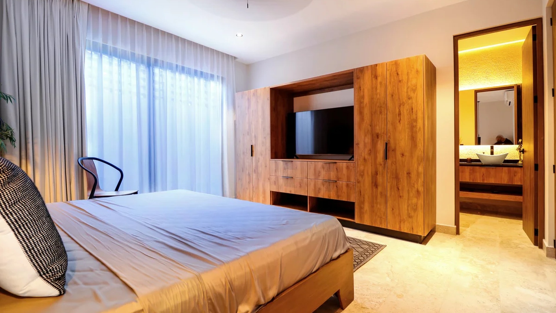 Image of a Modern Bedroom, featuring Ensuite Bathroom and Built-in Wood Wardrobe.
