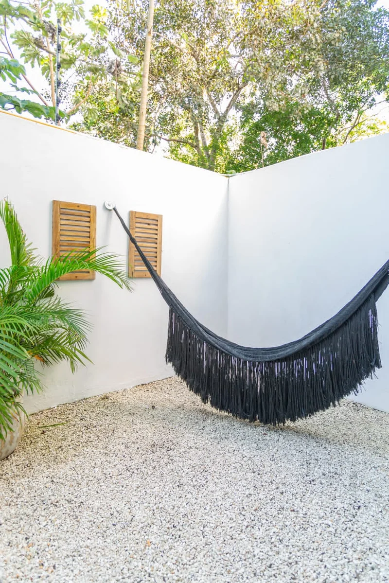 Image of a Private Courtyard, featuring Hammock Area and Minimalist Outdoor Space.
