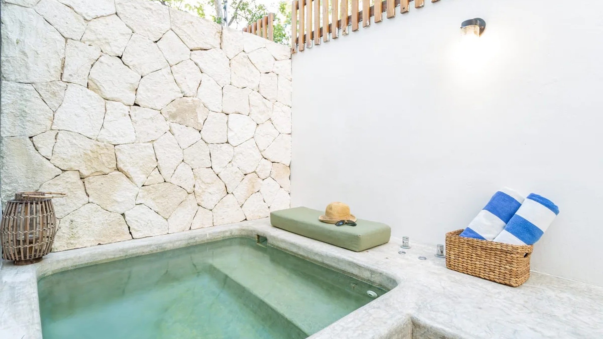 Image of a Private Plunge Pool, featuring Stone Accent Wall and Secluded Courtyard.