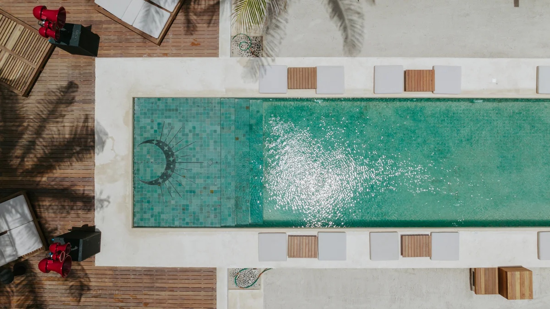 Image of a Swimming Pool, featuring Wooden Sun Deck and Mosaic Tile Pool.