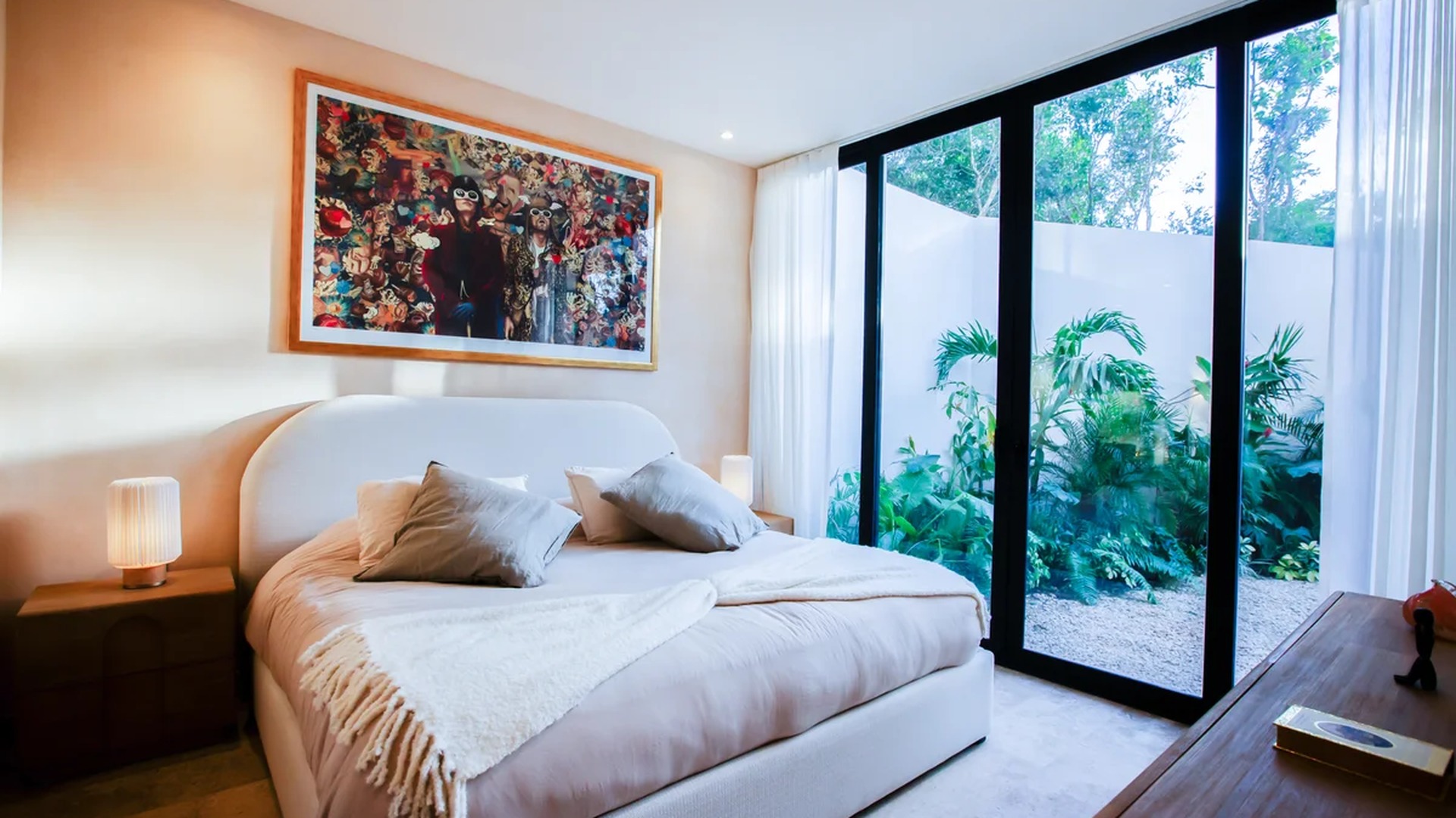 Image of a Modern Bedroom, featuring Floor-to-Ceiling Windows and Private Garden Access.