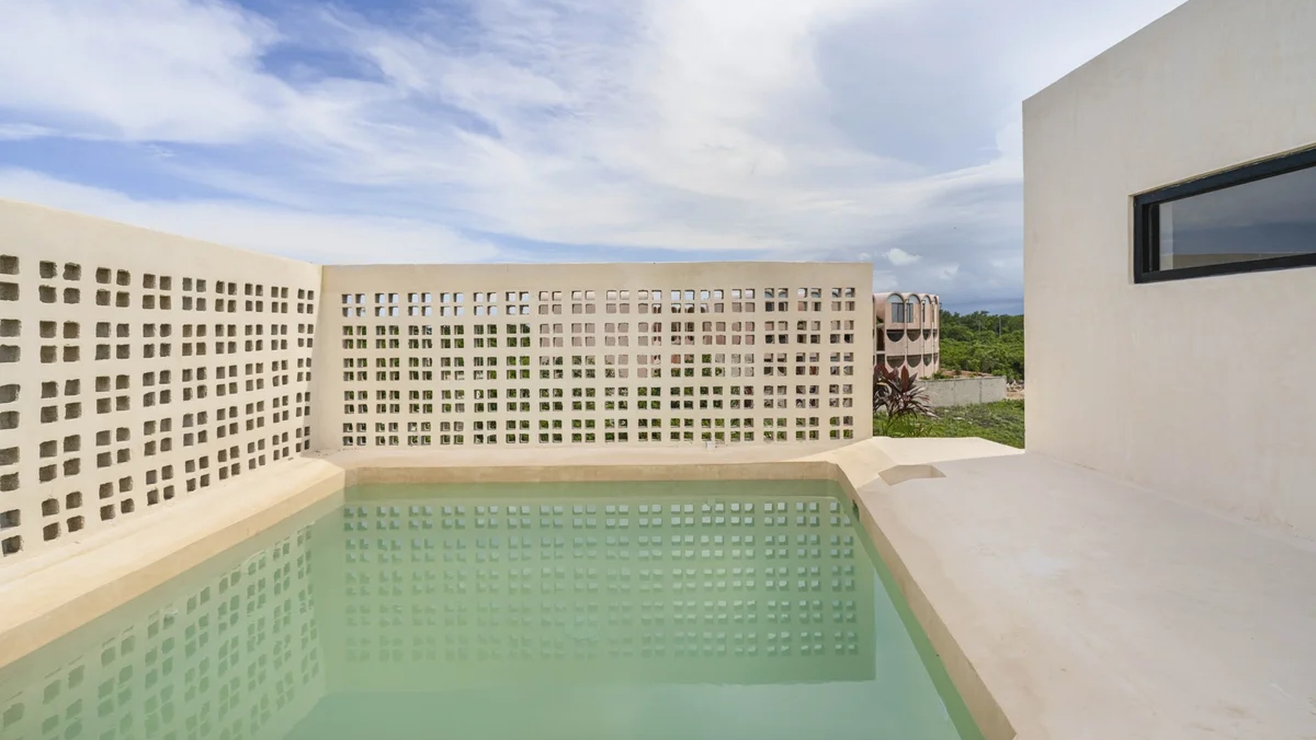 Image of a Rooftop Plunge Pool, featuring Private Terrace and Minimalist Architecture.