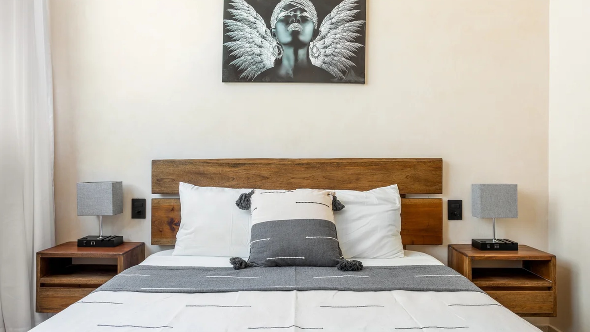 Image of a Primary Bedroom, featuring Wooden Headboard and Floating Nightstands.