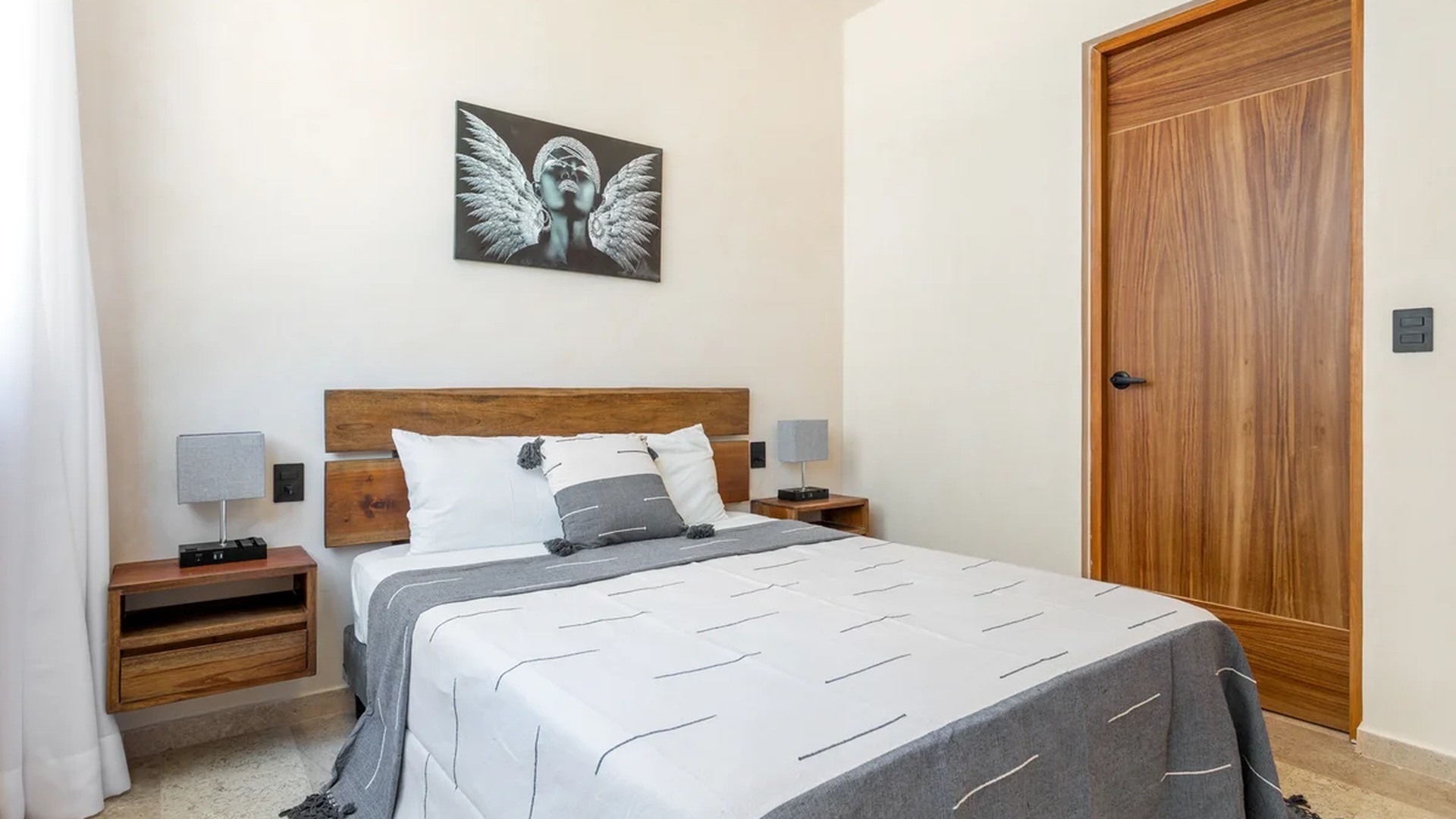 Image of a Bedroom, featuring Wooden Headboard and Floating Nightstands.