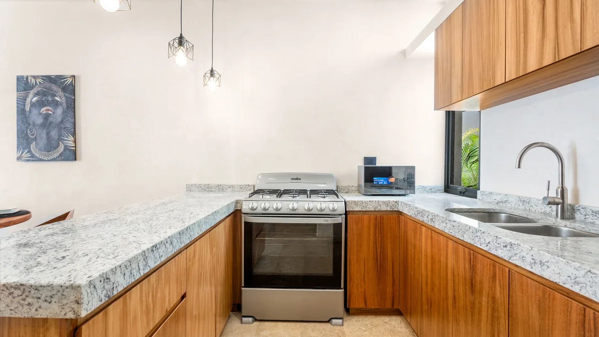 Image of a Modern Kitchen, featuring Granite Countertops and Wood Cabinetry.
