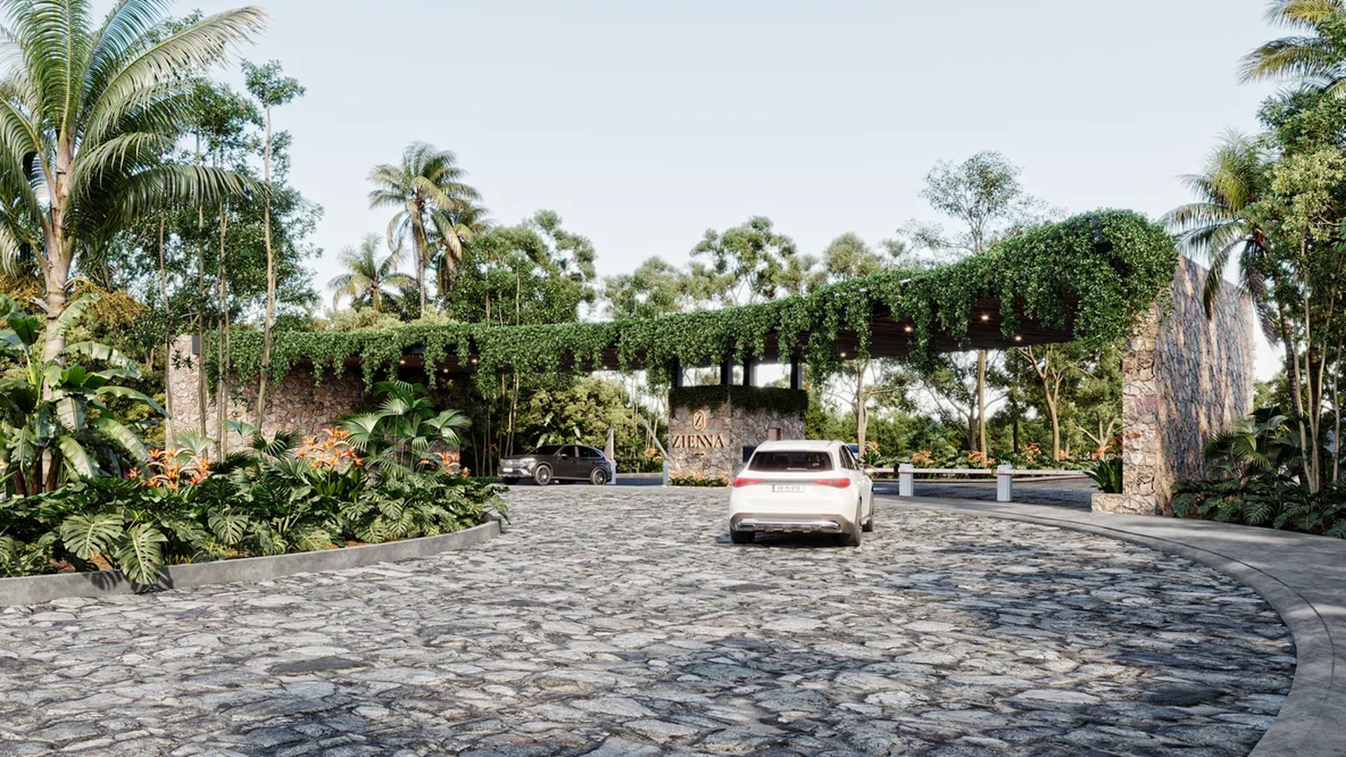 Image of a Gated Community Entrance, featuring Lush Tropical Landscaping and Natural Stone Walls.