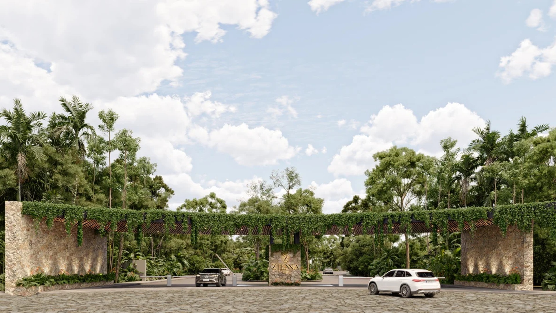 Image of a Gated Community Entrance, featuring Lush Tropical Landscaping and Natural Stone Walls.