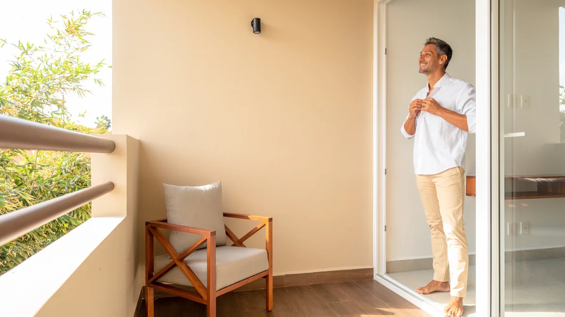 Image of a Private Balcony, featuring Sliding Glass Door and Wood-Look Tile Flooring.