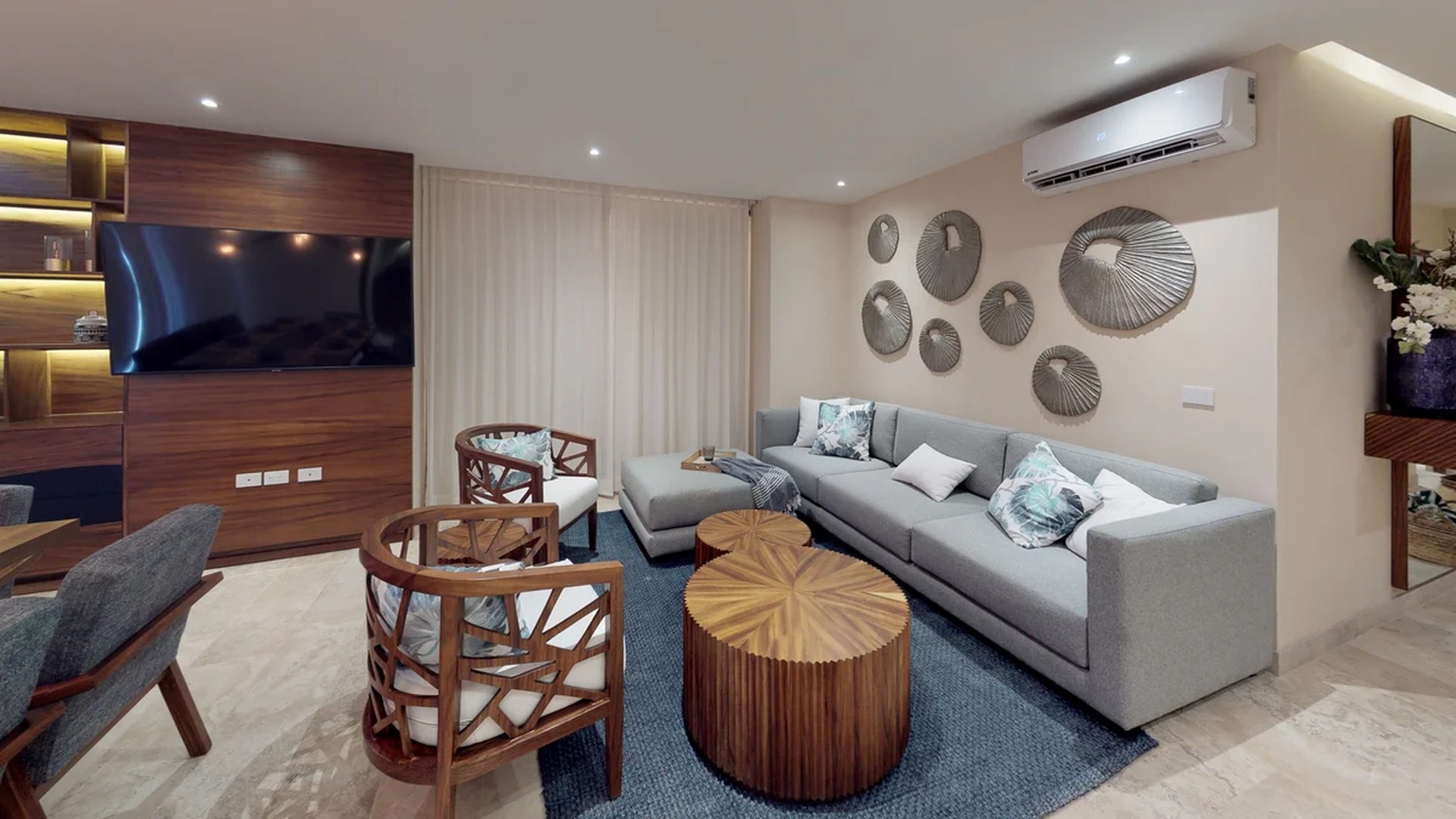 Image of a Contemporary Living Room, featuring Custom Wood Cabinetry and Marble Flooring.