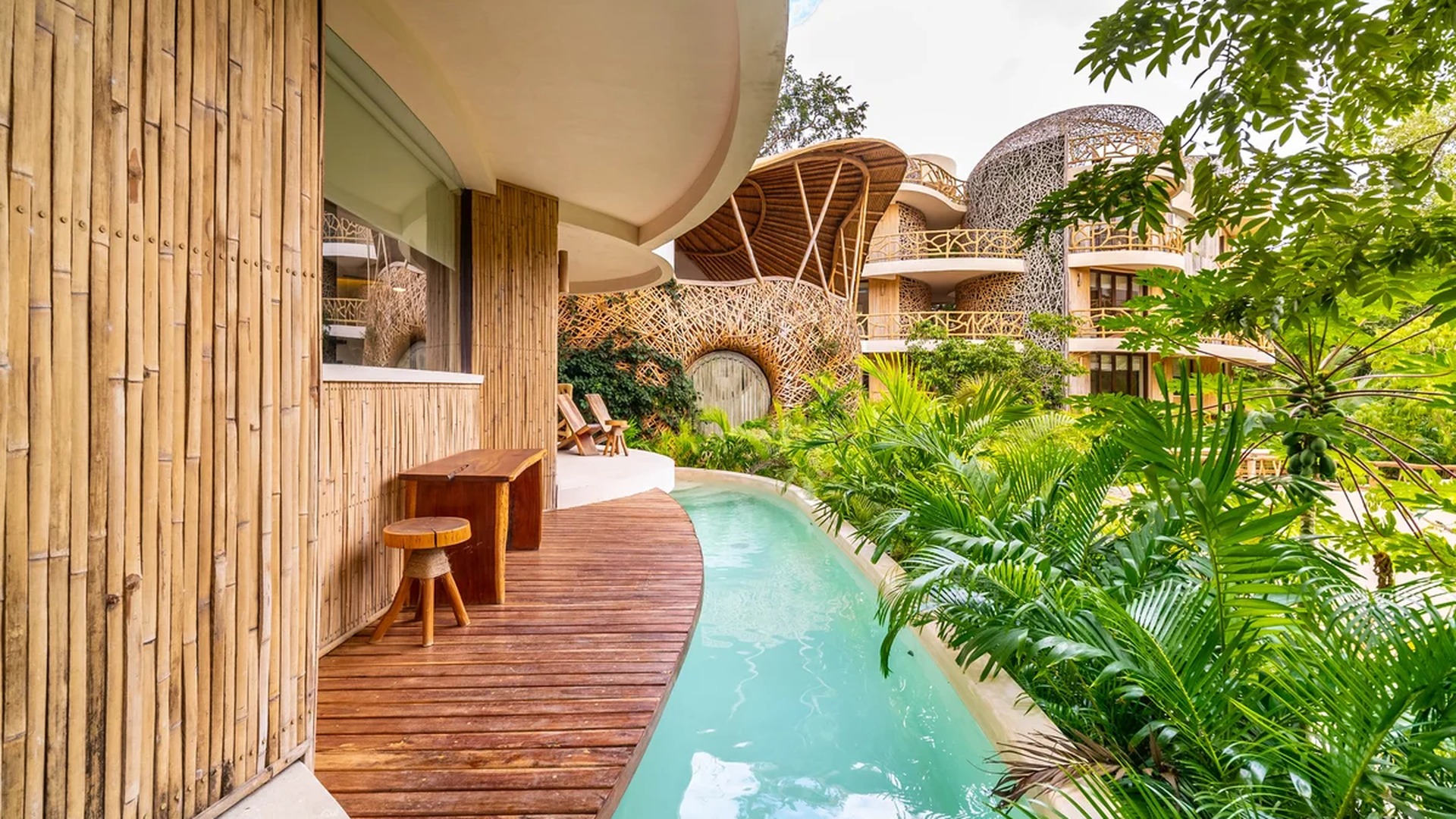 Image of a Swim-Up Suite, featuring Private Terrace and Bamboo Architecture.