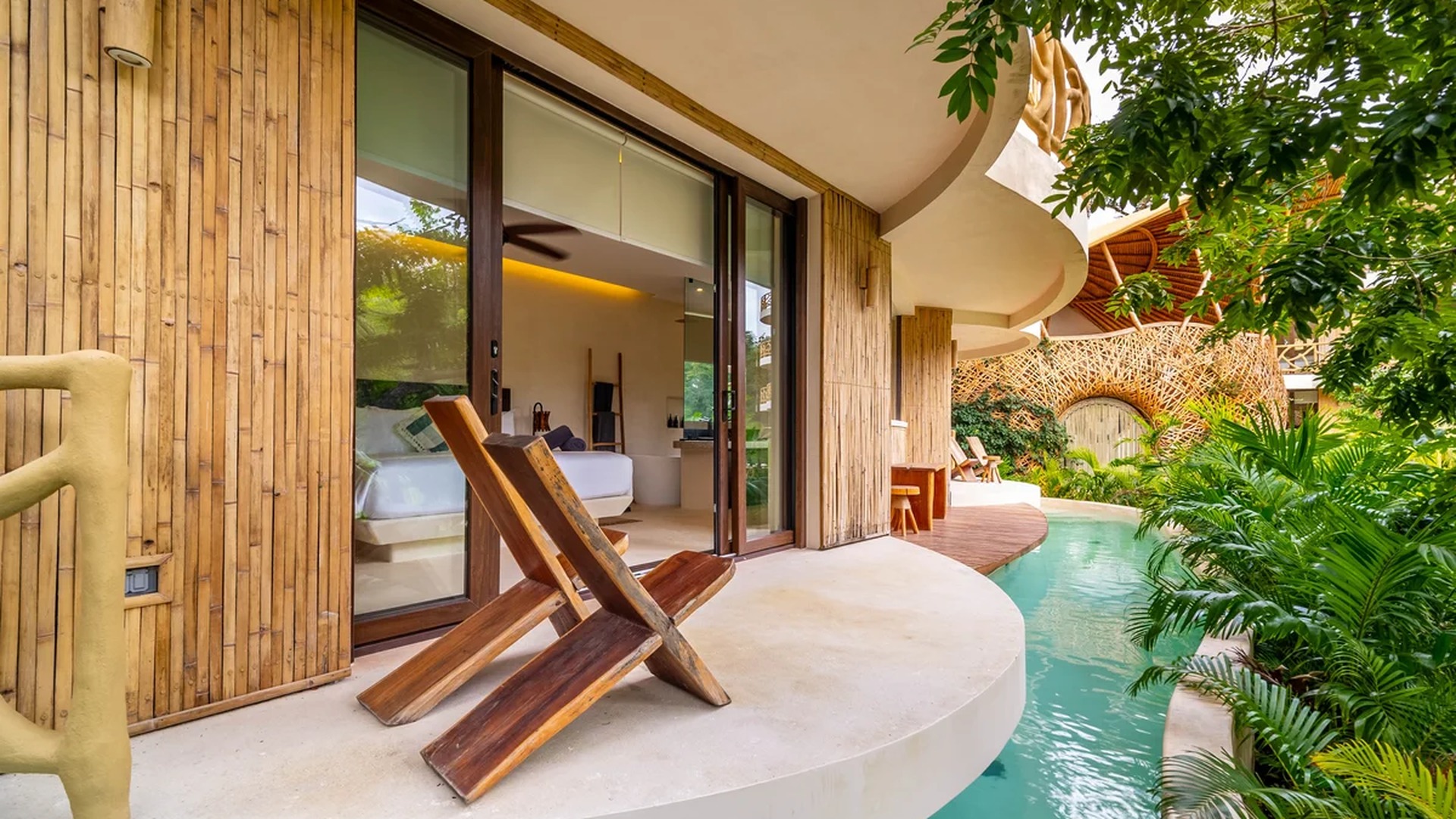 Image of a Swim-up Suite, featuring Private Terrace and Bamboo Architecture.