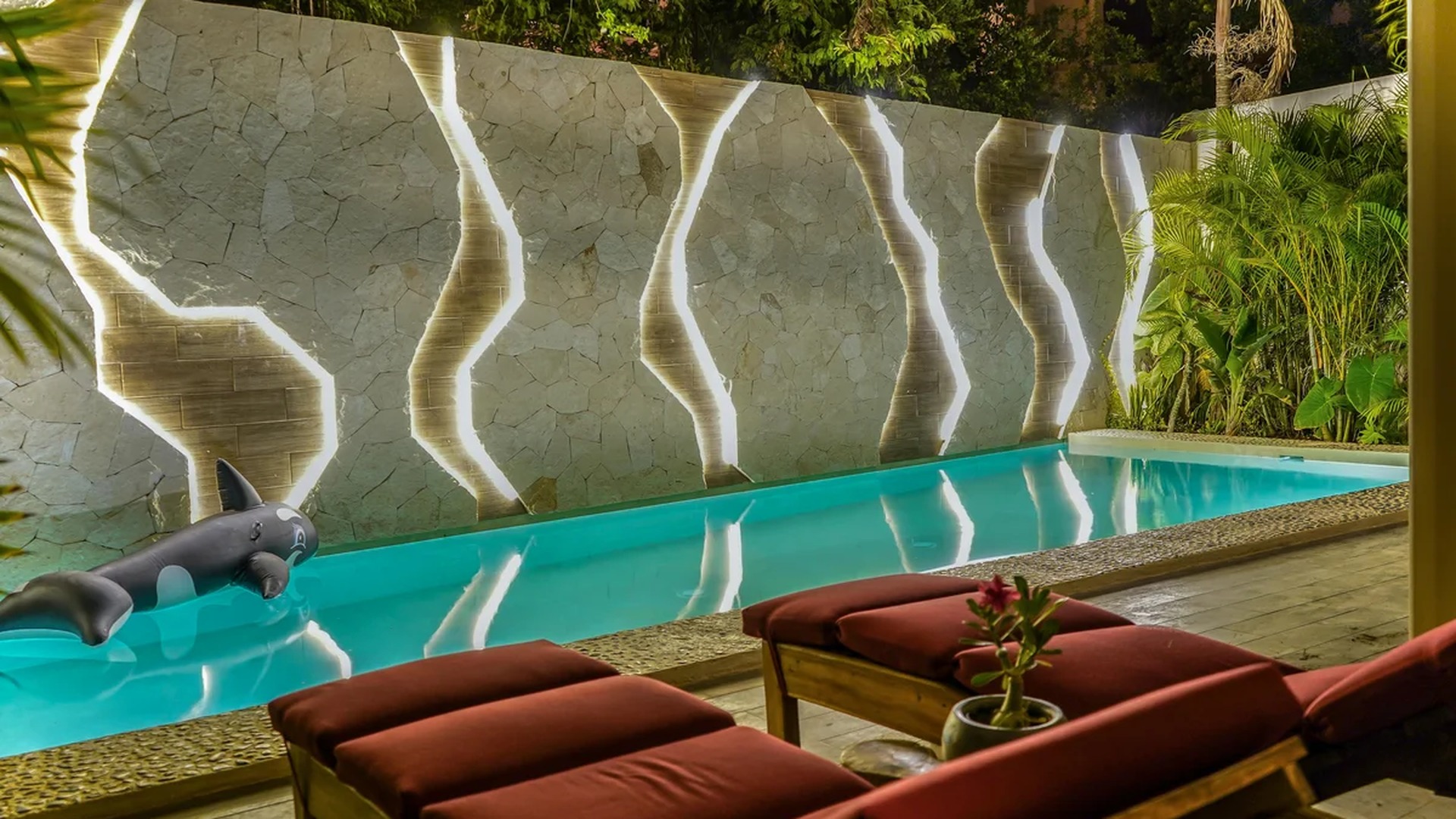 Image of a Private Pool, featuring Stone Accent Wall and LED Accent Lighting.