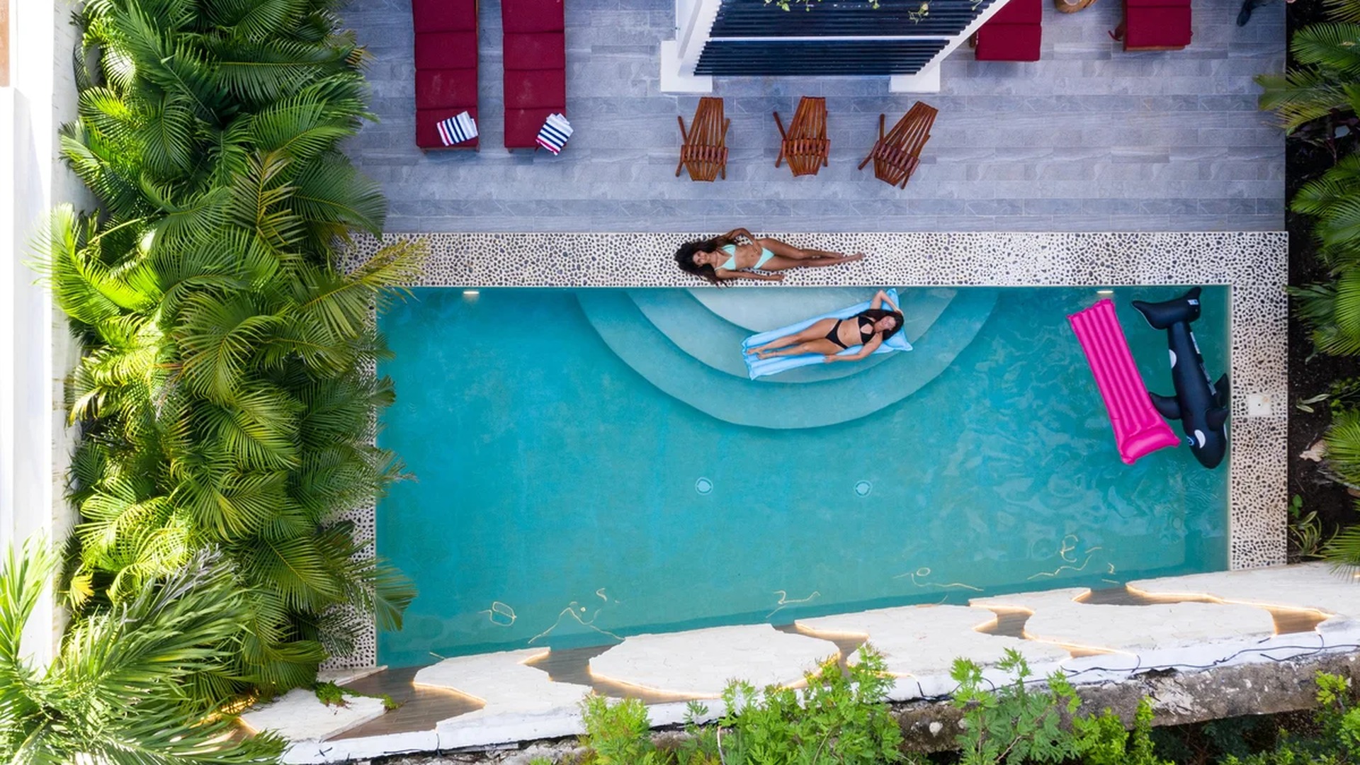 Image of a Private Swimming Pool, featuring Sun Deck and Tropical Landscaping.