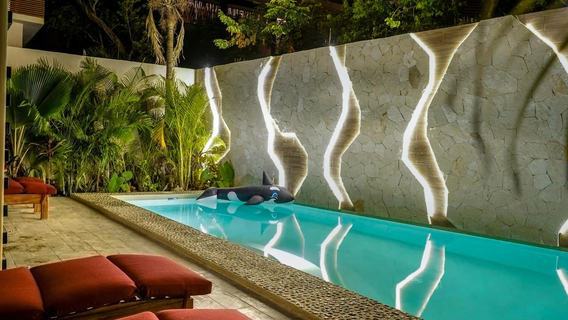 Image of a Private Pool, featuring Stone Accent Wall and LED Accent Lighting.