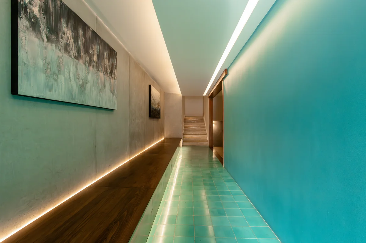 Image of a Modern Hallway, featuring Indoor Water Feature and Architectural Lighting.