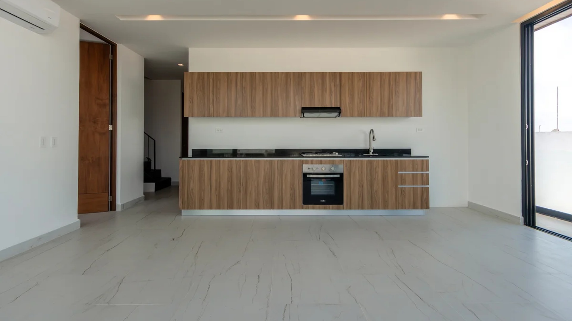 Image of a Modern Kitchen, featuring Open-Concept Layout and Wood-Grain Cabinetry.