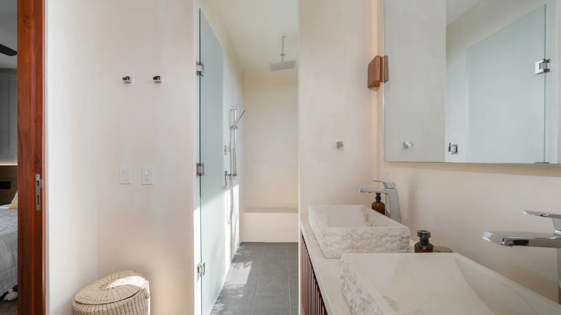 Image of a En-Suite Bathroom, featuring Double Vanity and Stone Vessel Sinks.