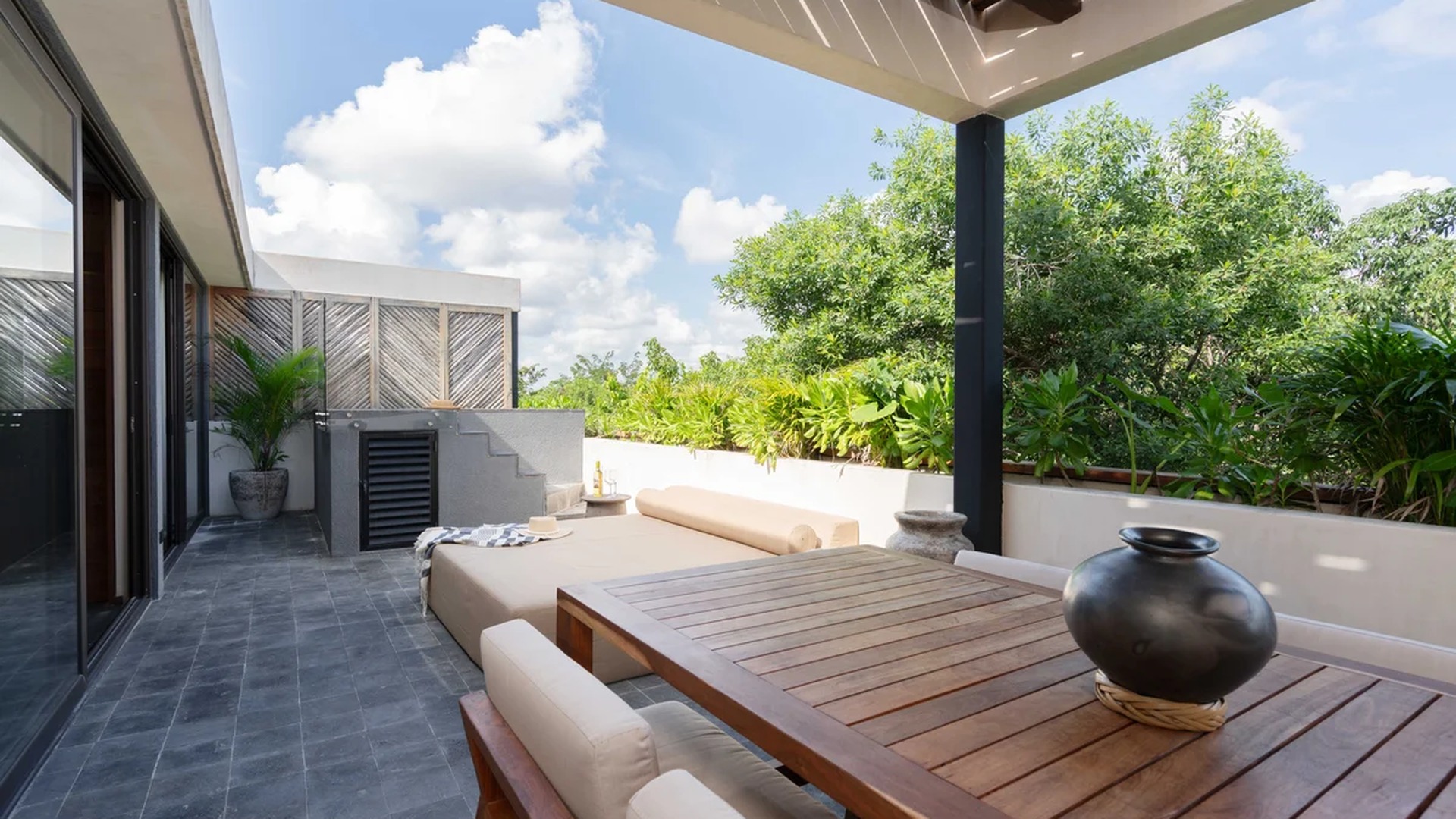 Image of a Rooftop Terrace, featuring Private Jacuzzi and Outdoor Dining Area.
