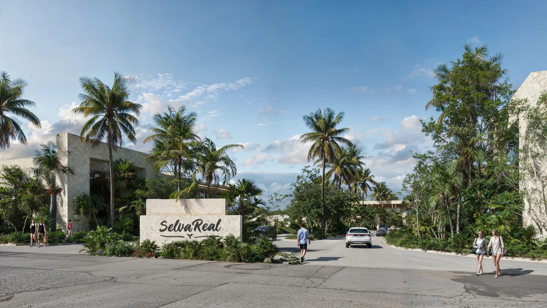 Image of a Gated Community Entrance, featuring Tropical Landscaping and Lush Greenery.
