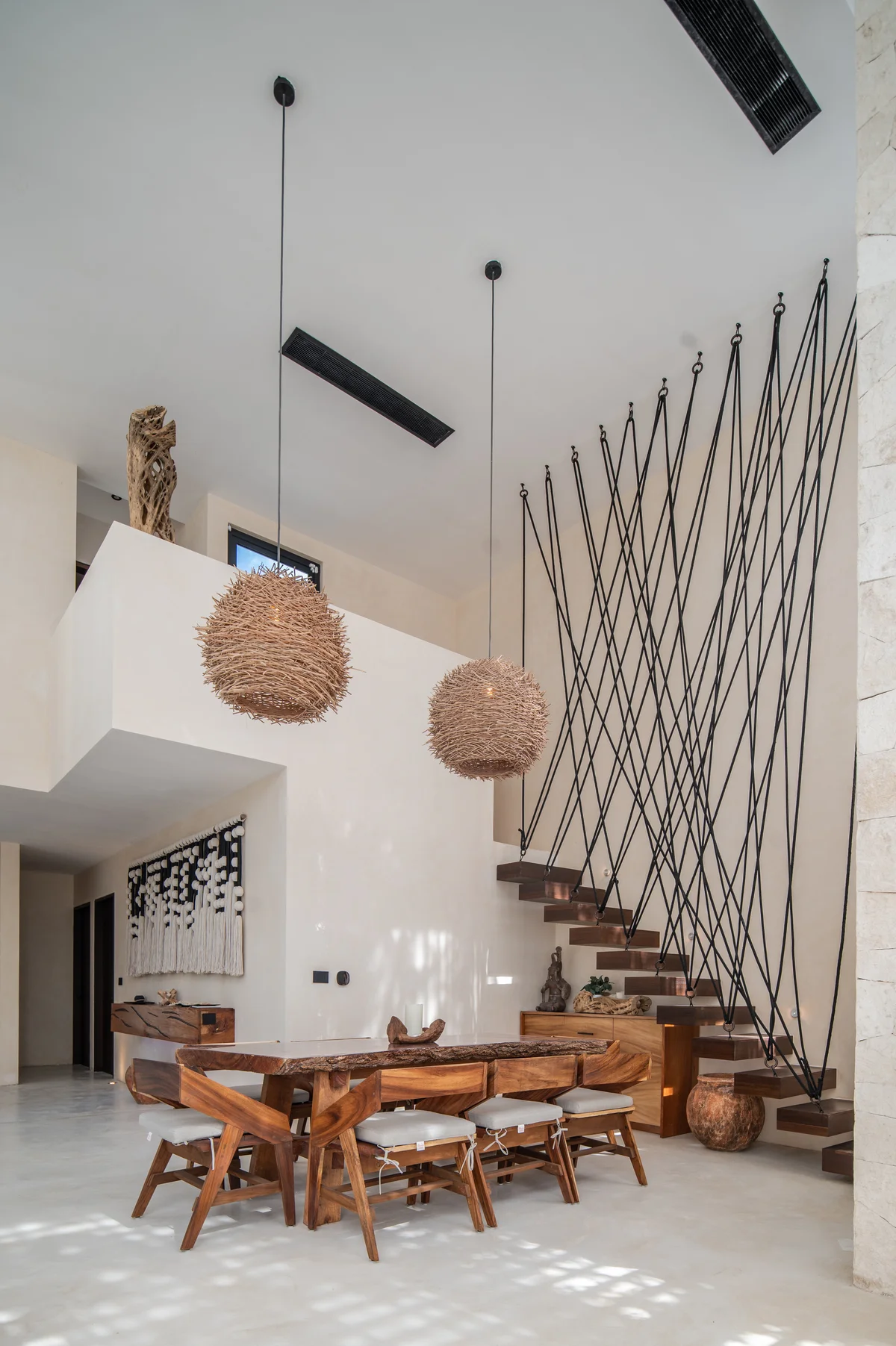 Image of a High Ceilings, featuring Architectural Staircase and Dining Area.