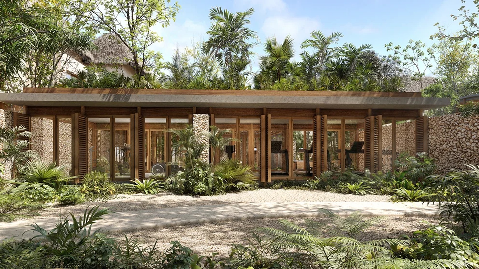 Image of a Resort-Style Gym, featuring Lush Tropical Garden and Natural Stone Walls.