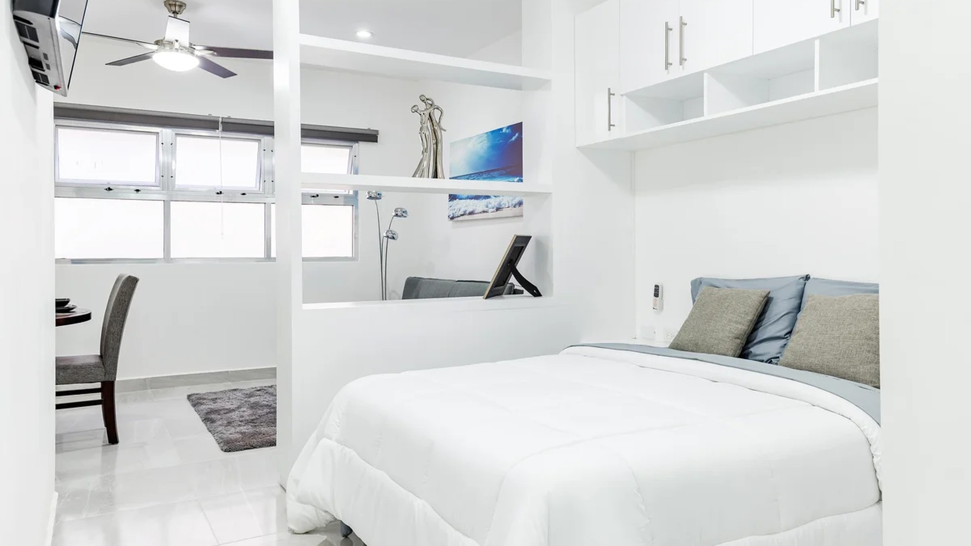 Image of a Studio Apartment, featuring Modern Design and Built-in Shelving.