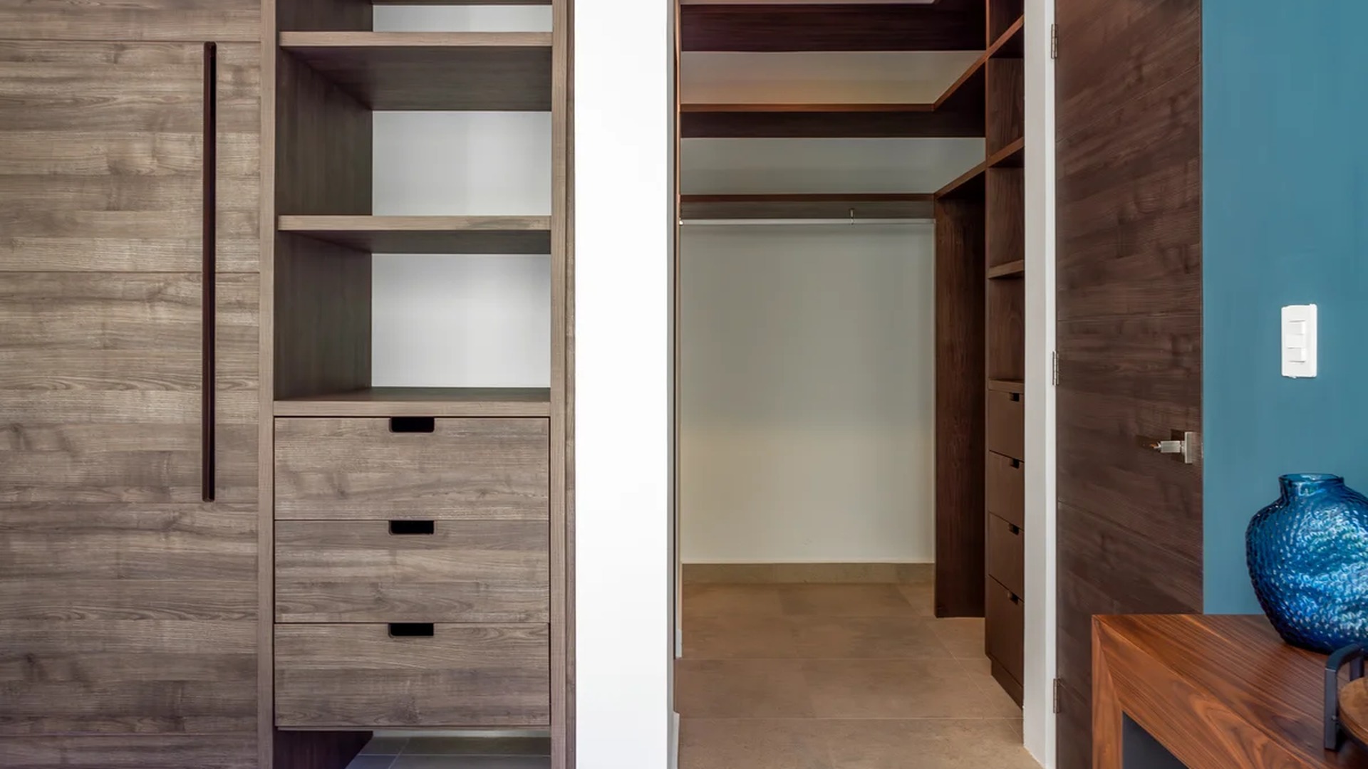 Image of a Walk-in Closet, featuring Built-in Wardrobe and Custom Cabinetry.