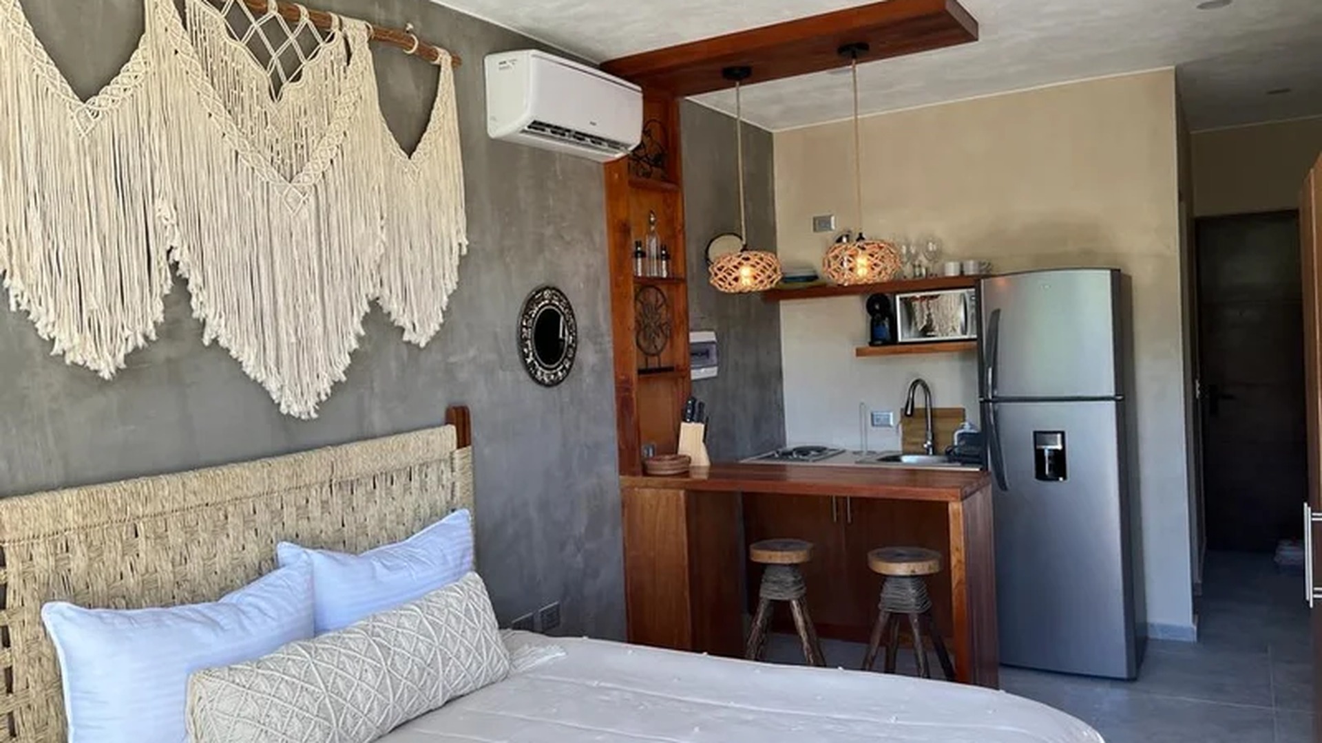 Image of a Studio Apartment, featuring Kitchenette and Bohemian Decor.