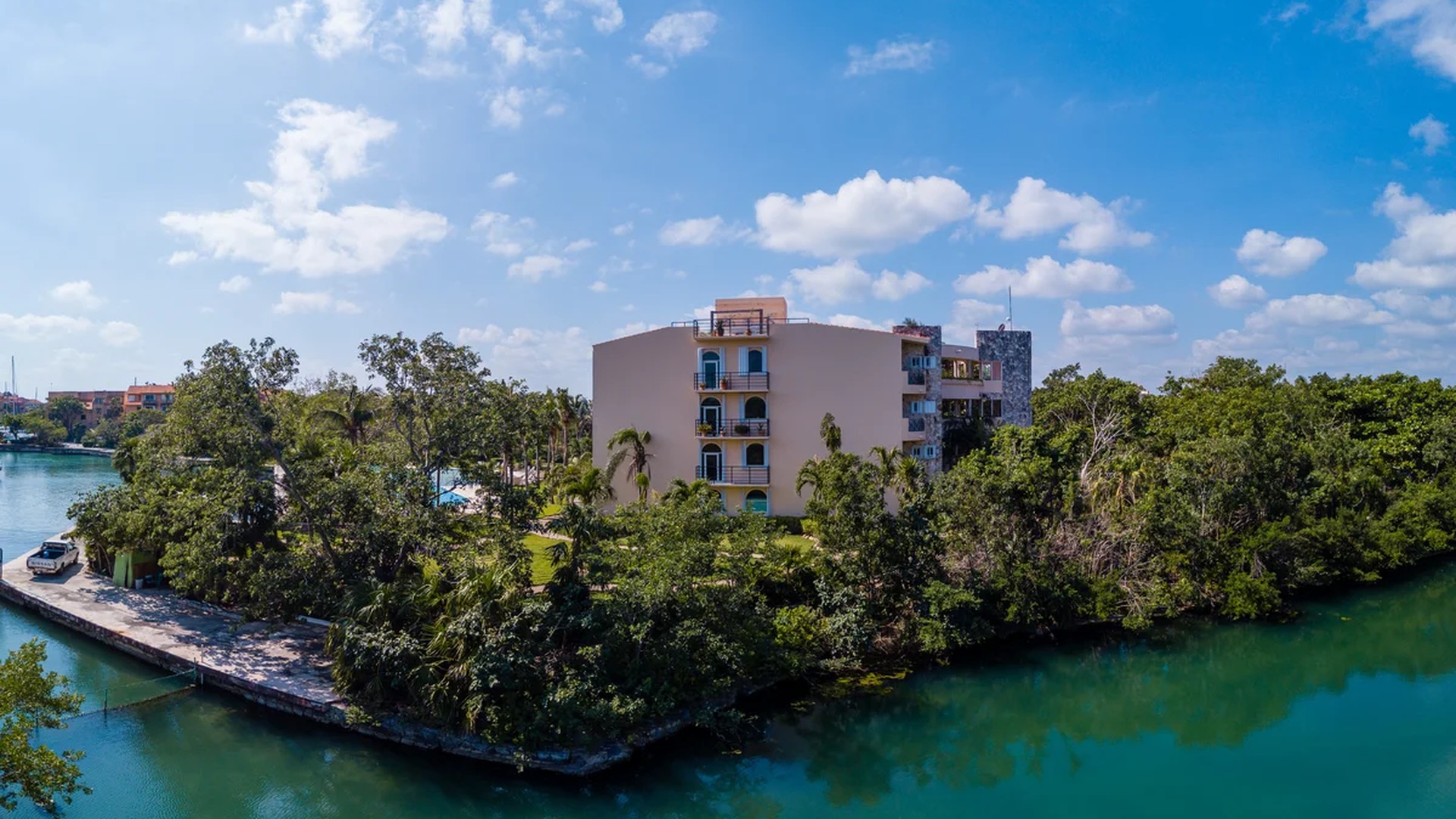 Image of a Waterfront Property, featuring Canal View and Lush Landscaping.