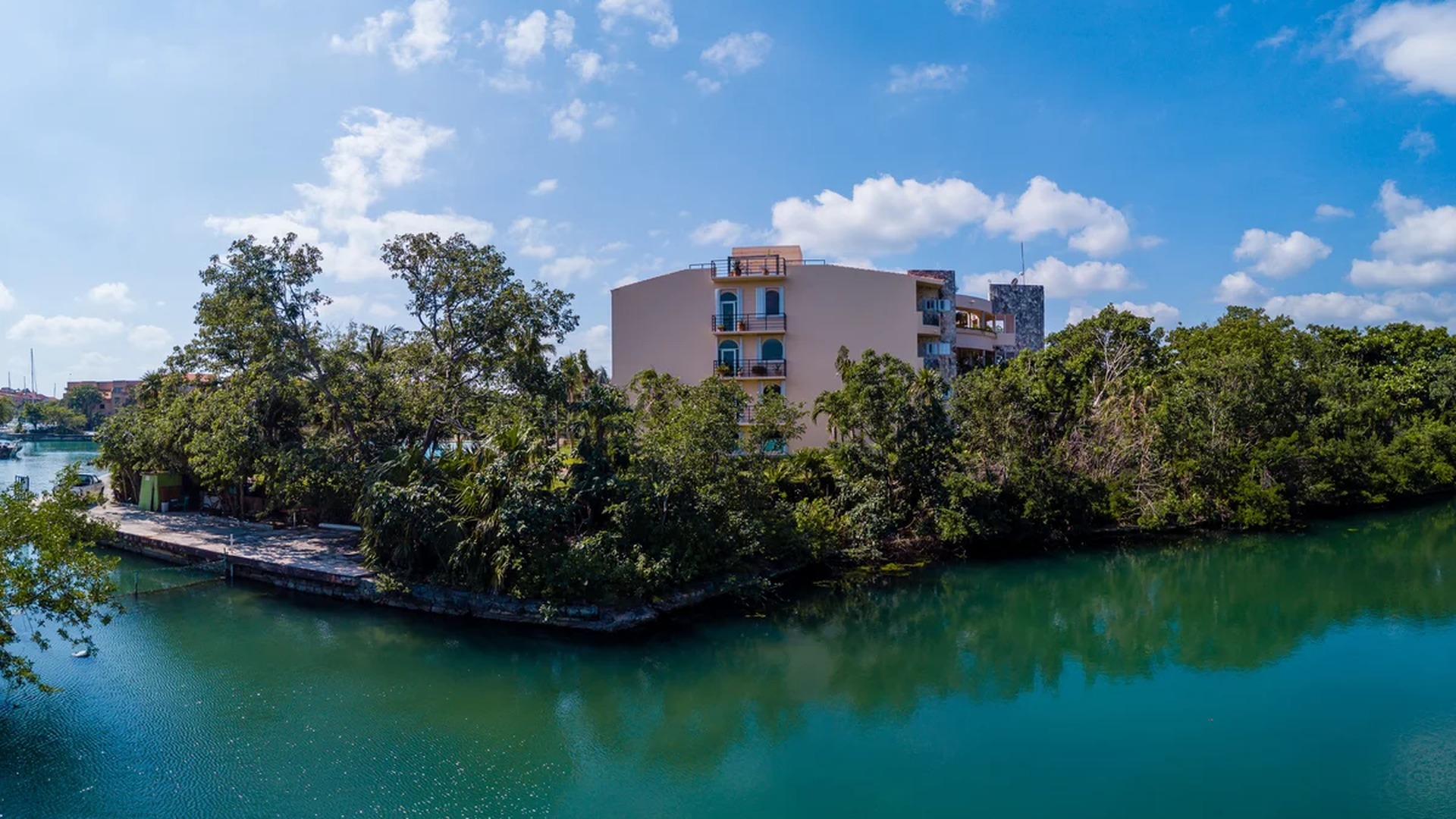 Image of a Waterfront Property, featuring Canal View and Lush Landscaping.