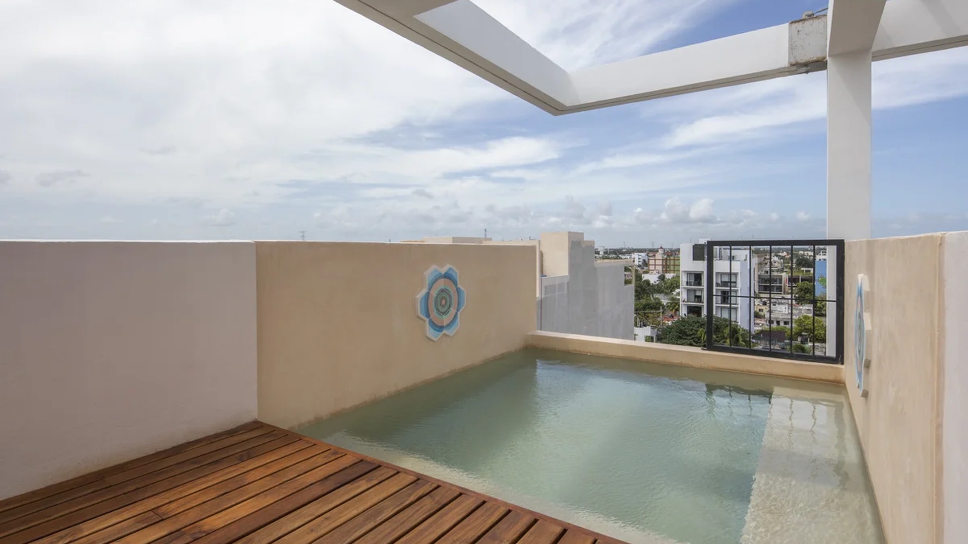 Image of a Rooftop Plunge Pool, featuring Private Terrace and Wooden Sun Deck.