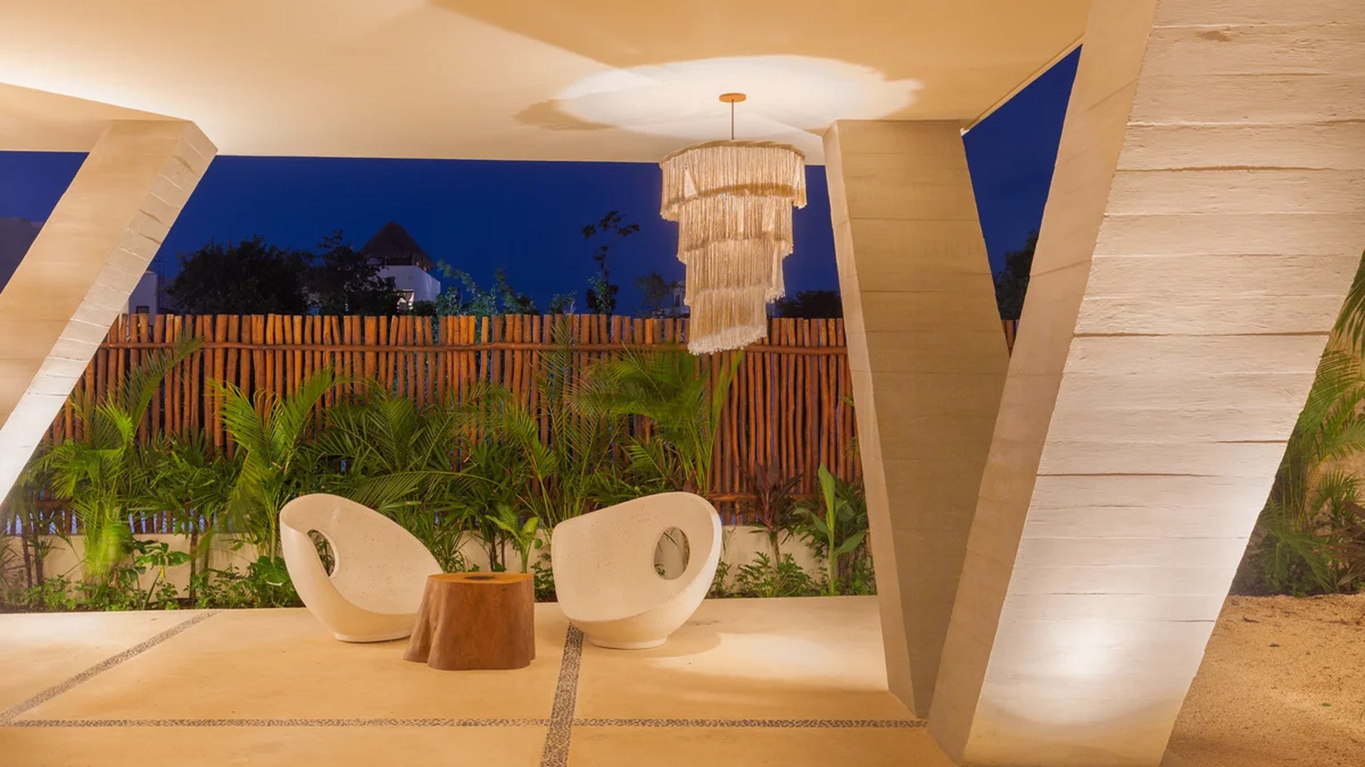 Image of a Covered Outdoor Lounge, featuring Modern Architectural Design and Tropical Garden.