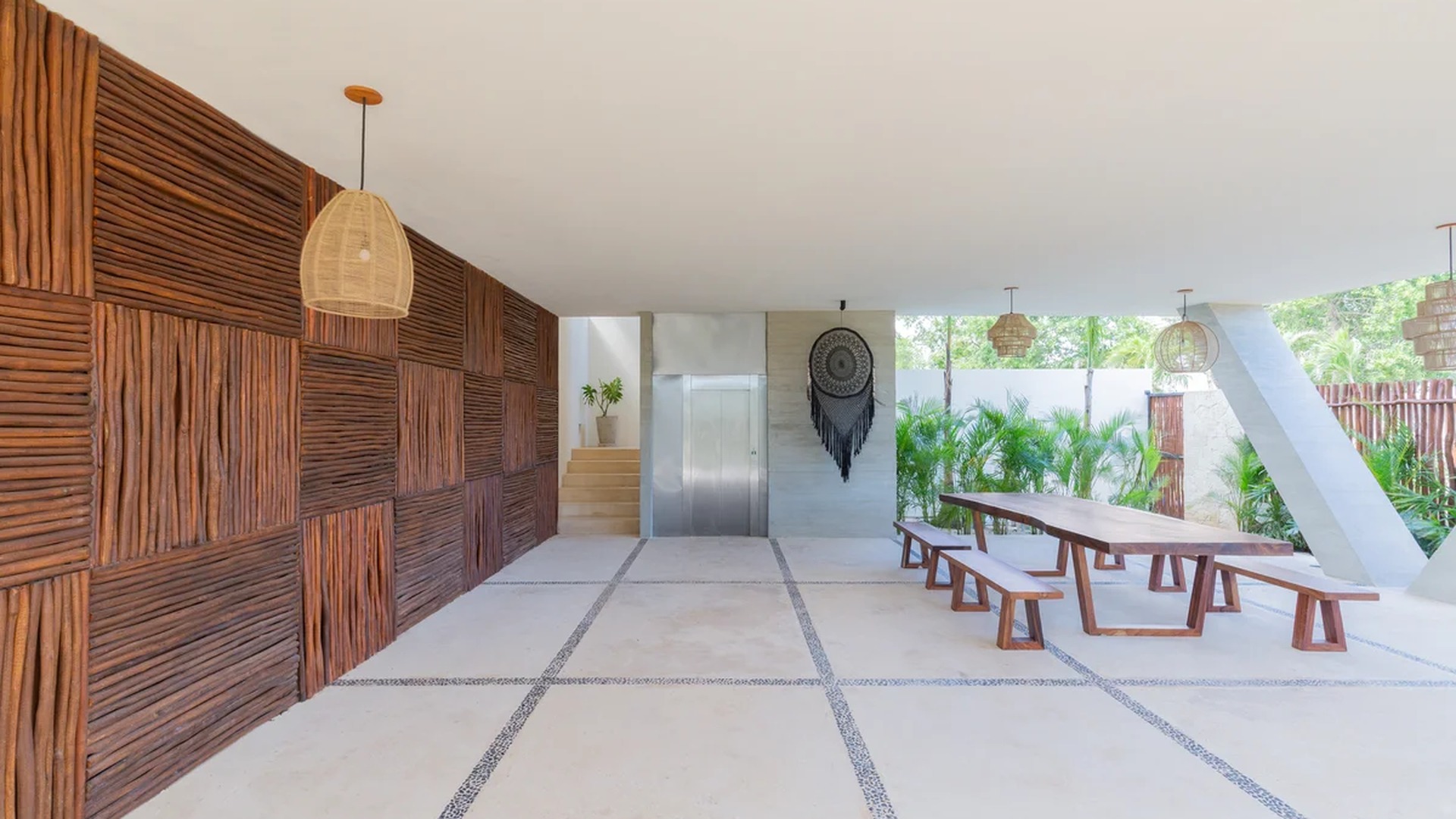 Image of a Communal Lounge Area, featuring Indoor-Outdoor Living and Textured Wood Wall.