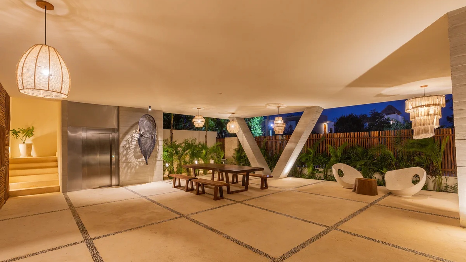 Image of a Covered Outdoor Lounge, featuring Elevator Access and Bohemian-Chic Decor.