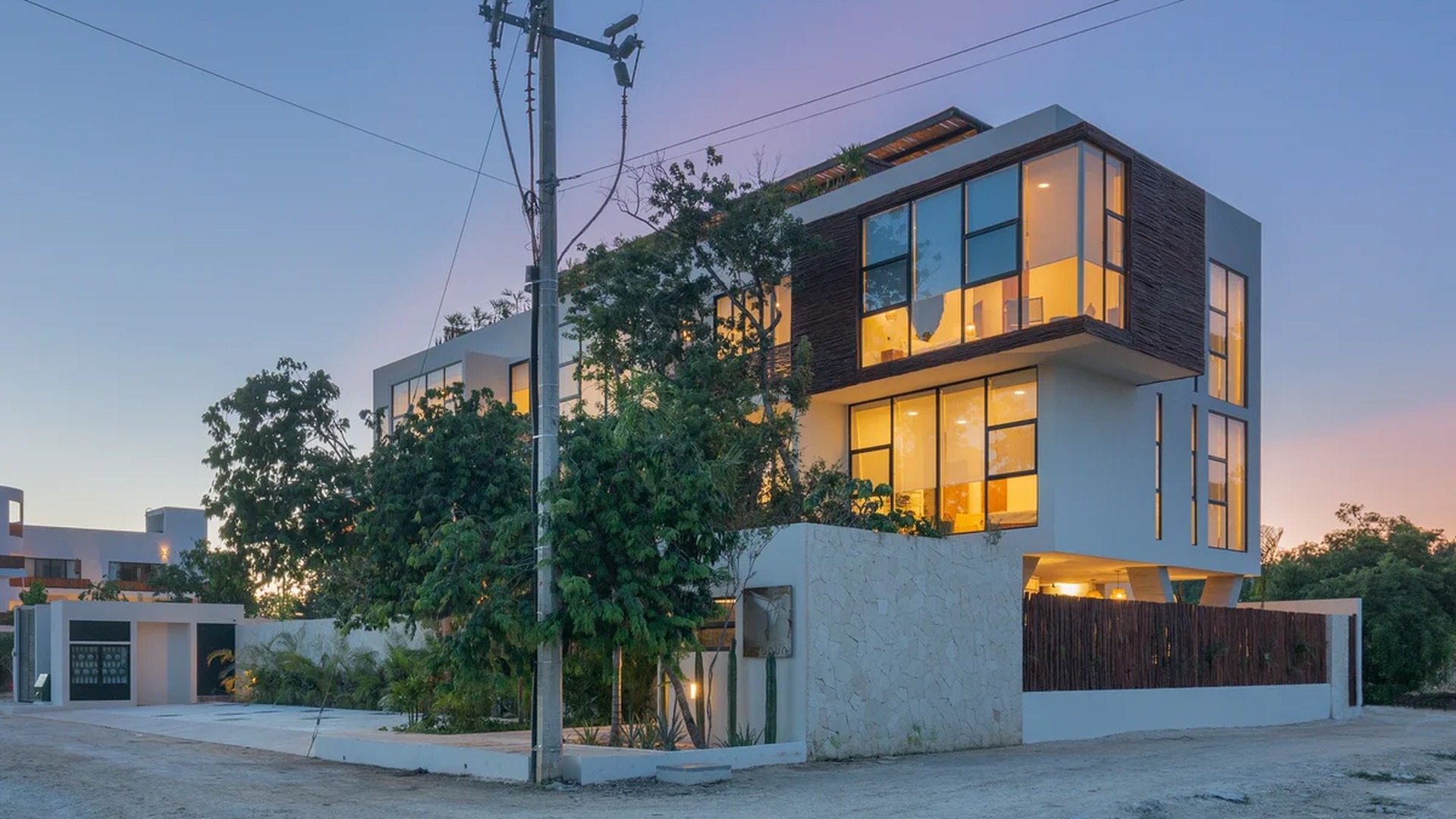 Image of a Modern Architecture, featuring Floor-to-Ceiling Windows and Multi-Level Home.