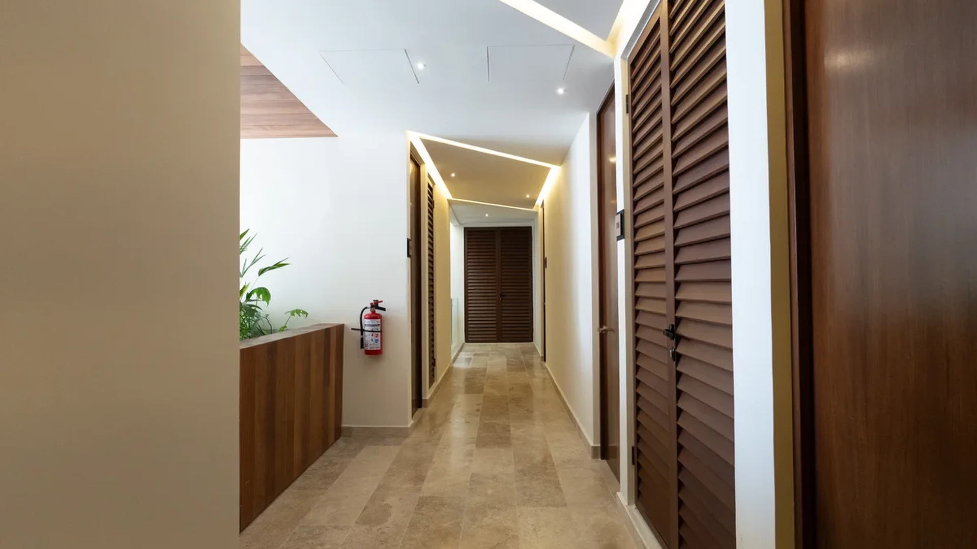 Image of a Interior Hallway, featuring Stone Tile Flooring and Modern Lighting Design.