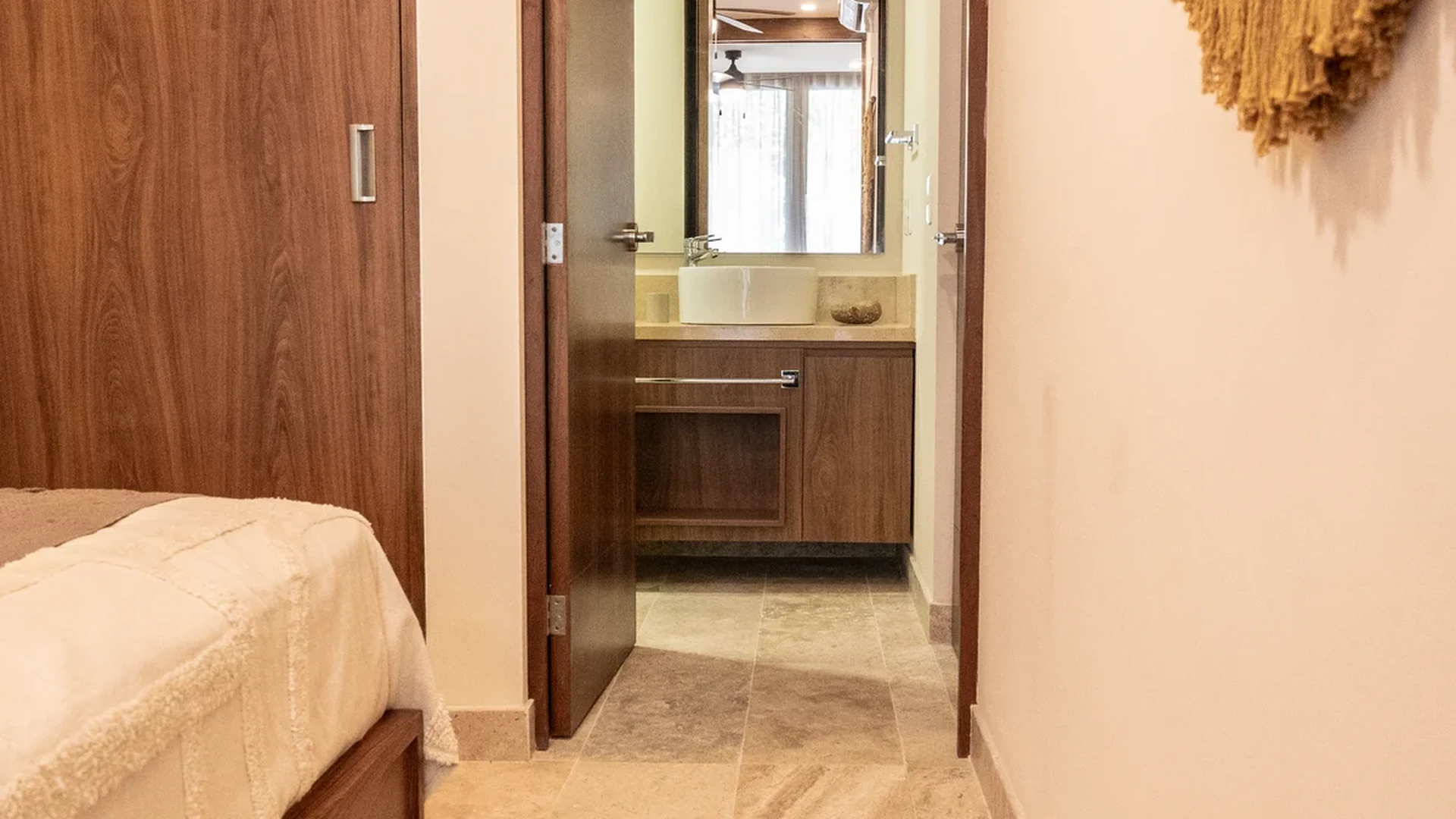 Image of a Bedroom, featuring En-suite Bathroom and Stone Tile Flooring.