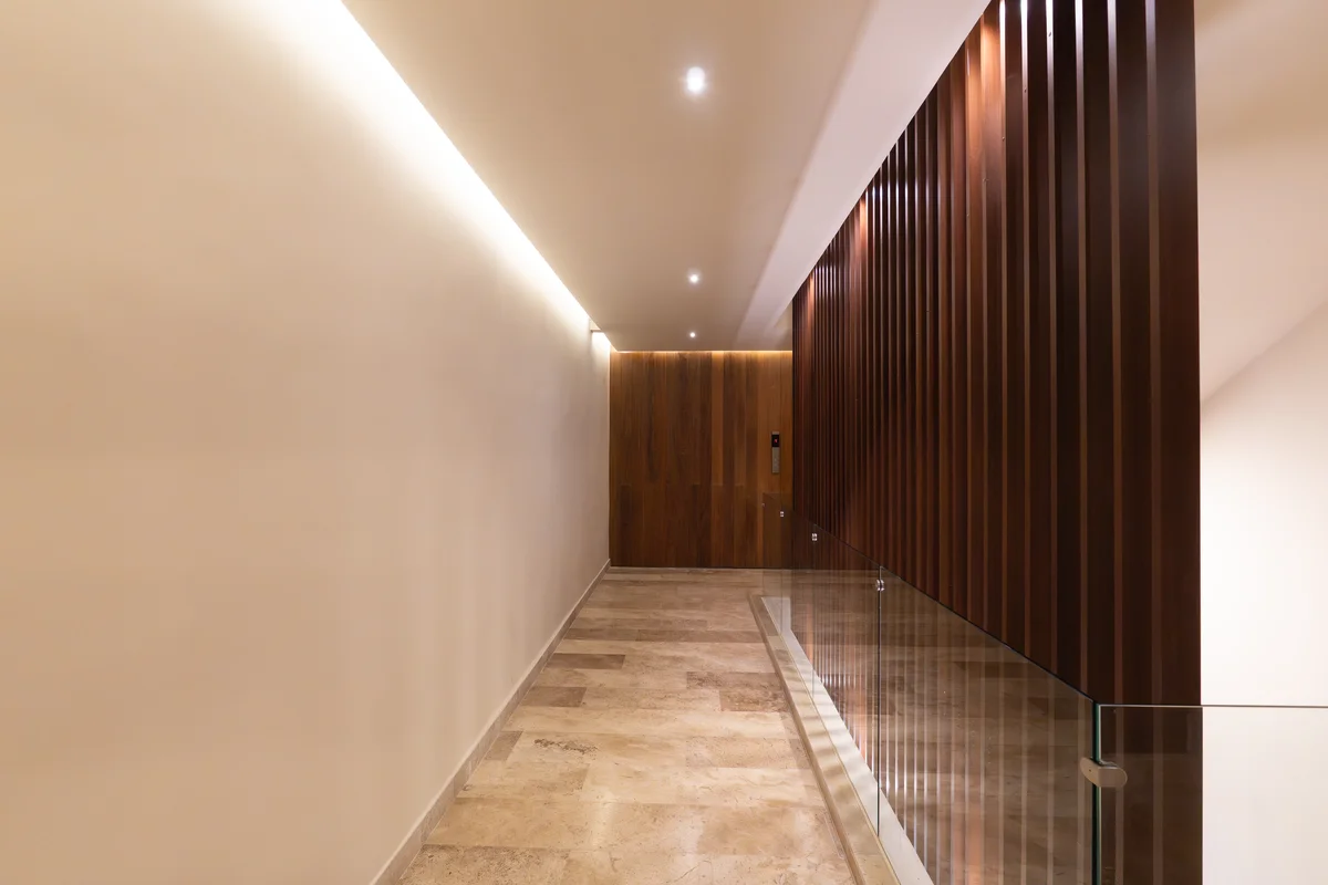 Image of a Modern Hallway, featuring Elevator Lobby and Travertine Flooring.